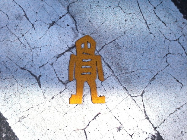 yellow stikman in crosswalk
