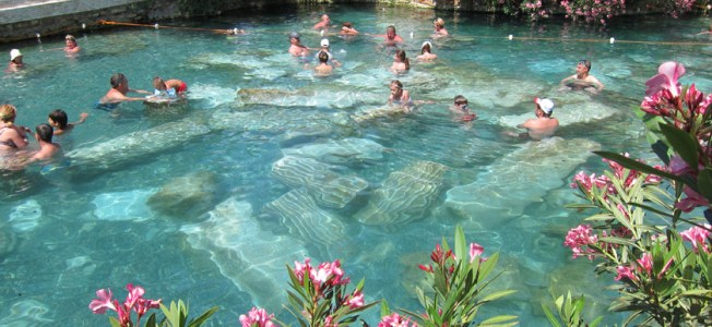 Swimming with columns in the Hierapolis thermal pool, Pamukkale, Turkey